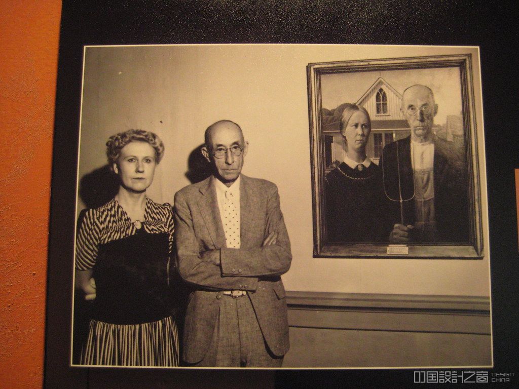 posing by their likeness in american gothic