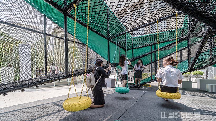 swings suspended beneath play object at charoenkrung