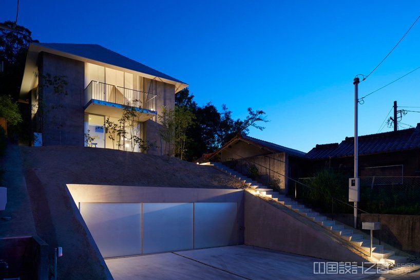 airhouse tops house on a sloping hill in seto, japan, with