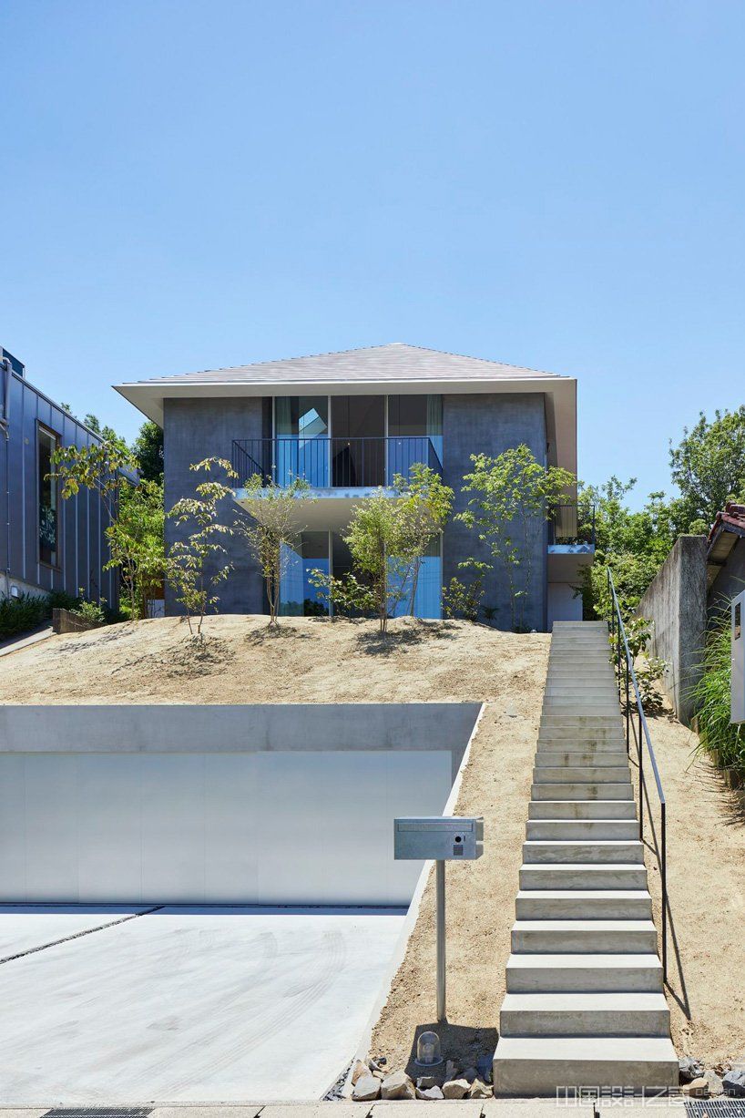 airhouse tops house on a sloping hill in seto, japan, with